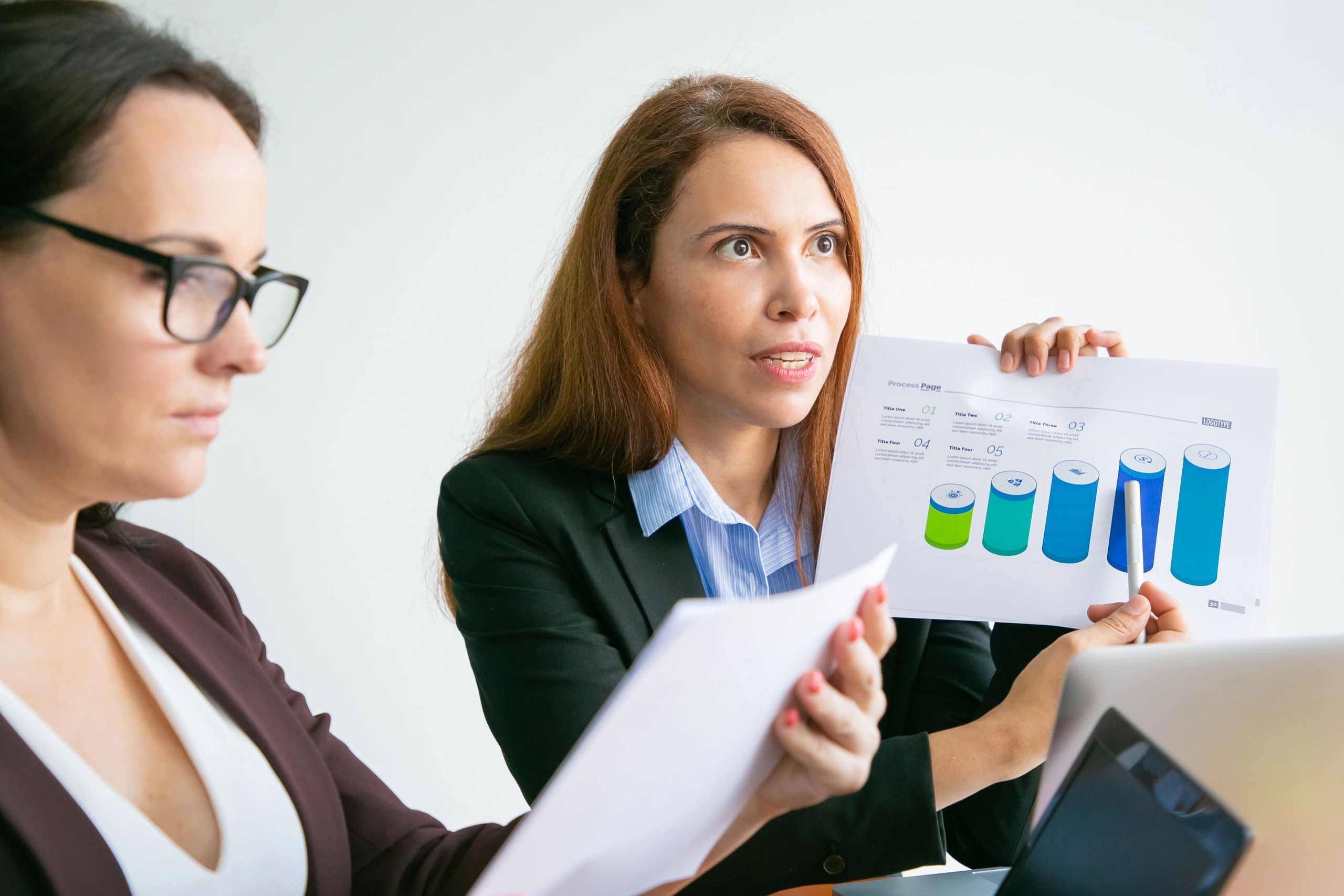 Accounting professionals reviewing reports together