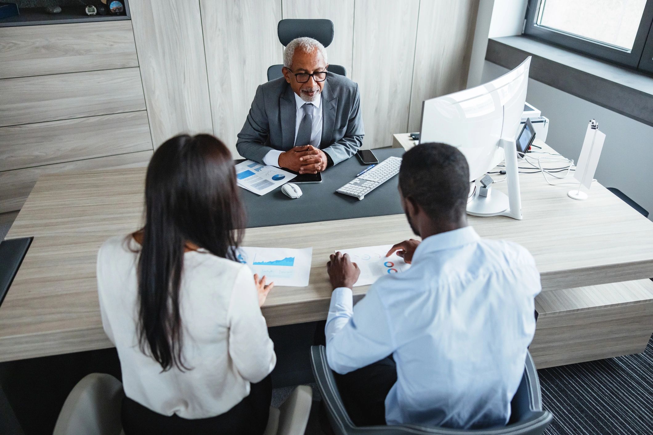 LedgerOps team collaborating around a meeting table