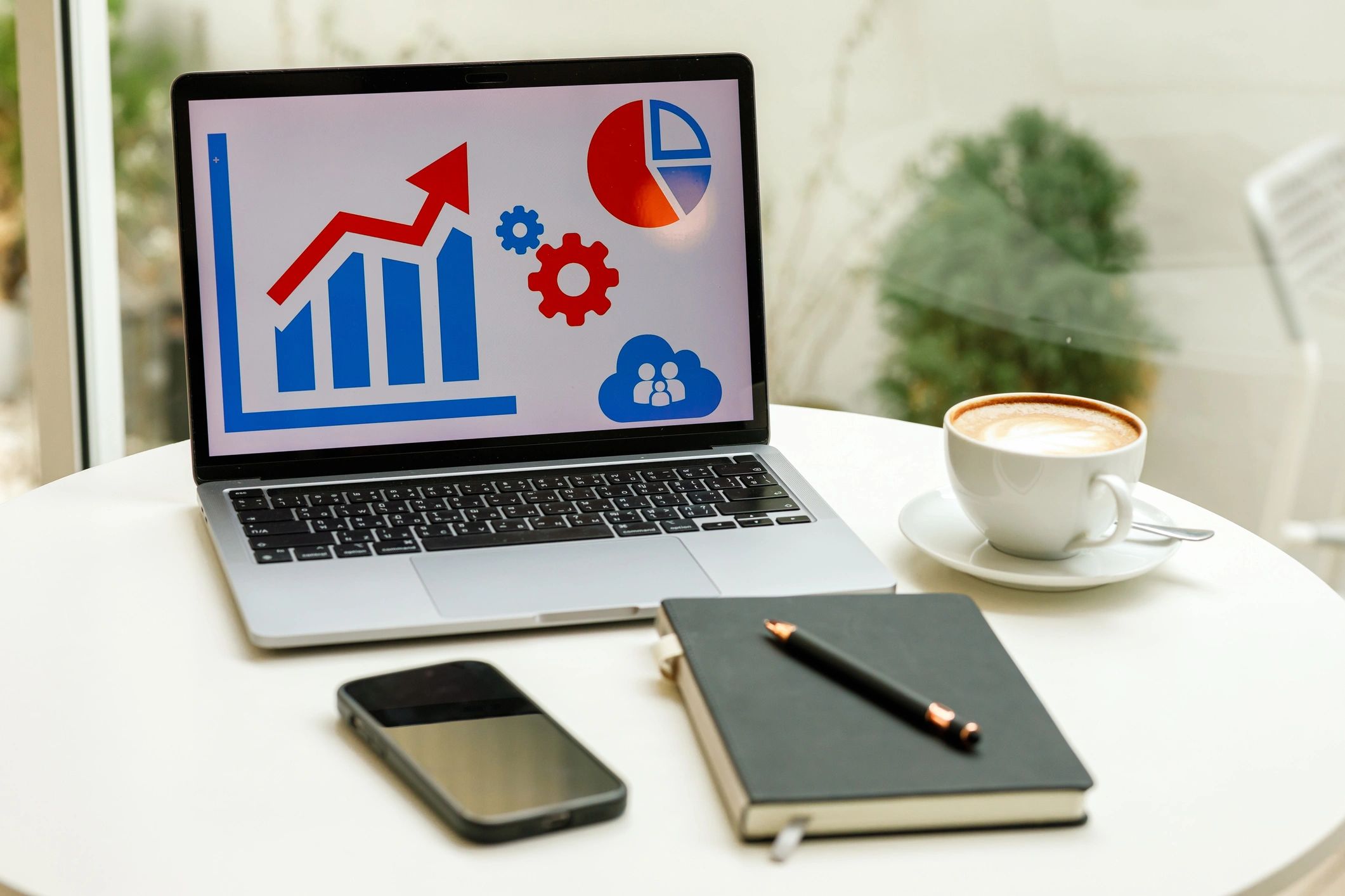 Workspace with laptop and financial growth chart
