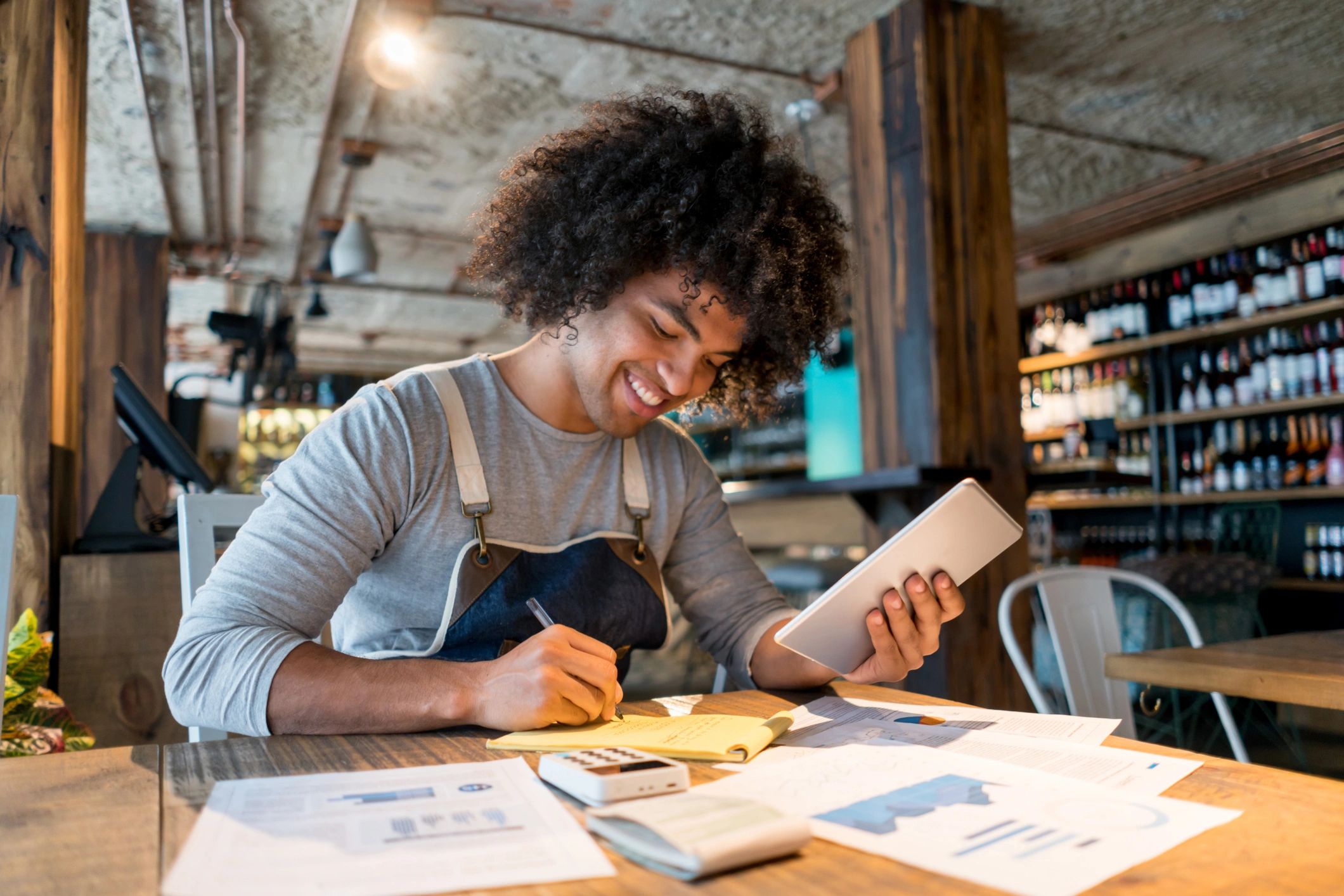 Bookkeeper using a tablet to manage small business finances